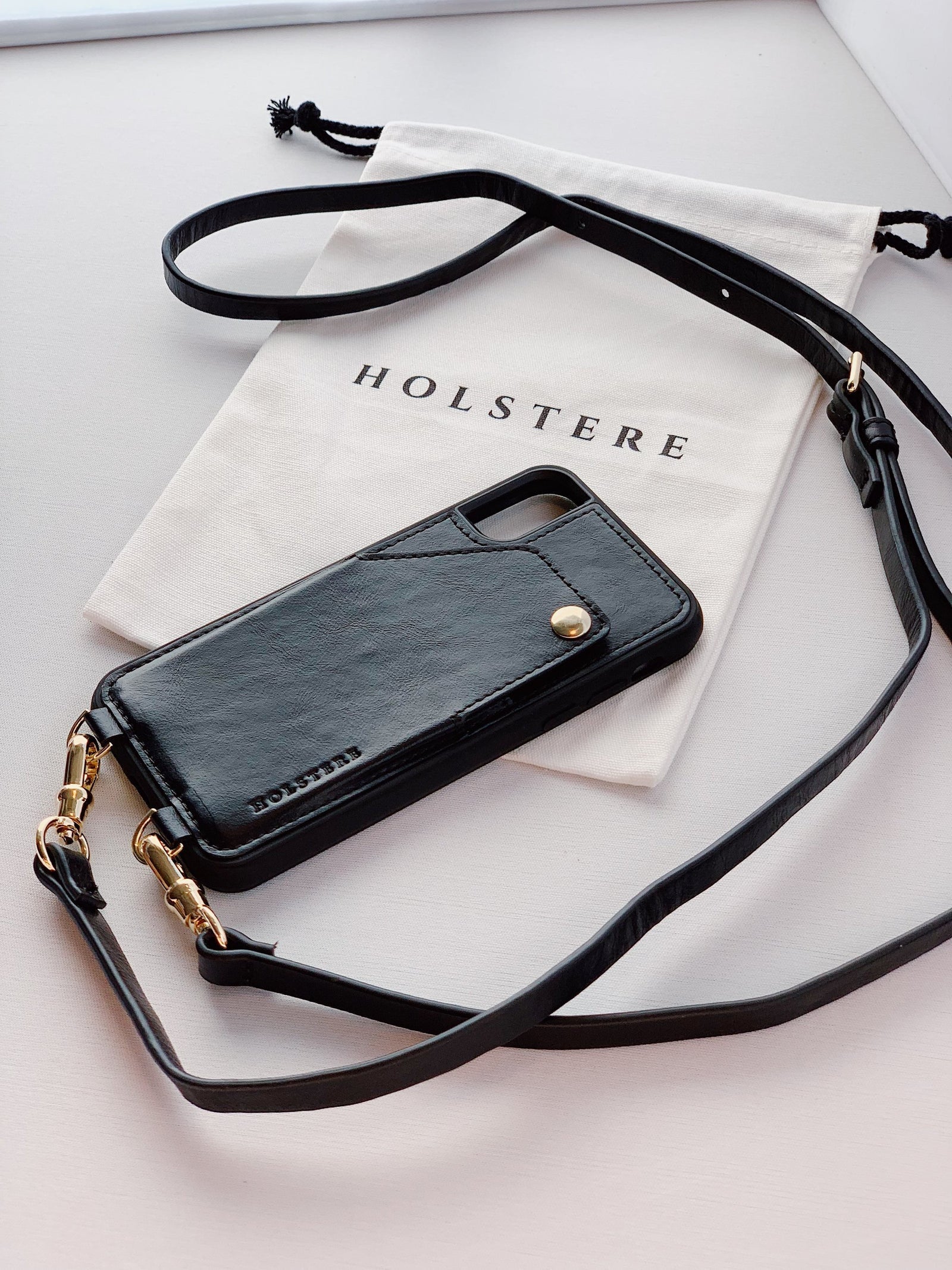 Holstere Black London iphone pouch with gold hardware